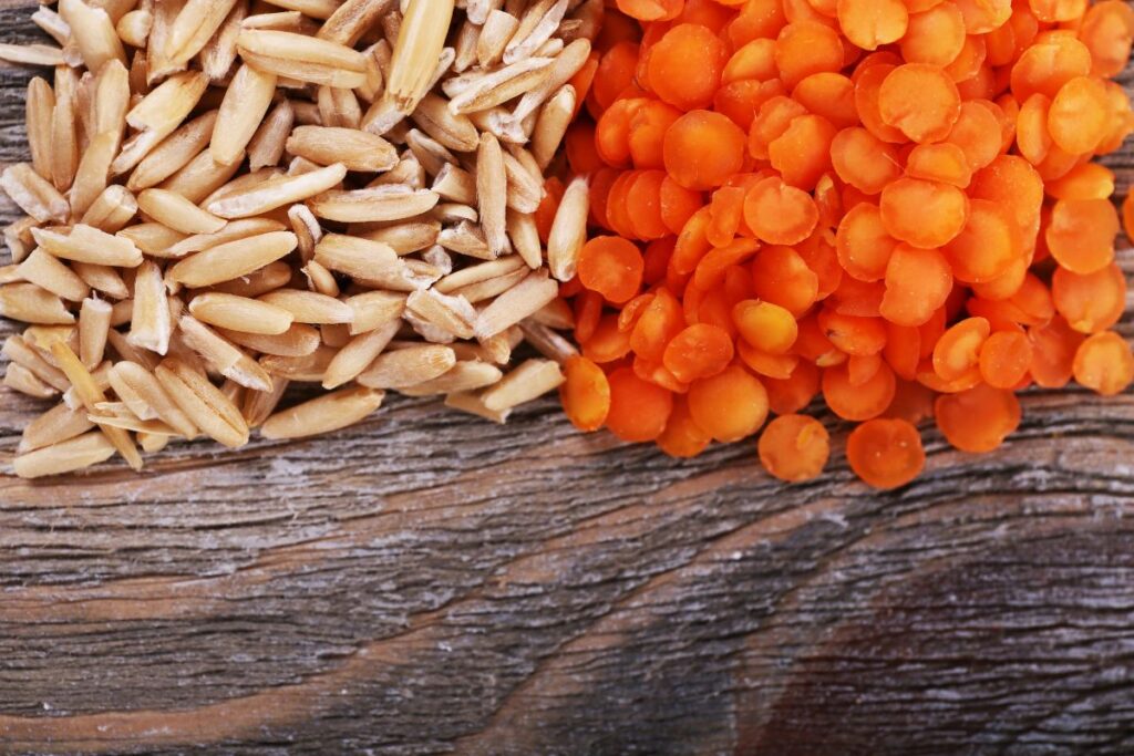 Lentils and Oats on Wooden Background