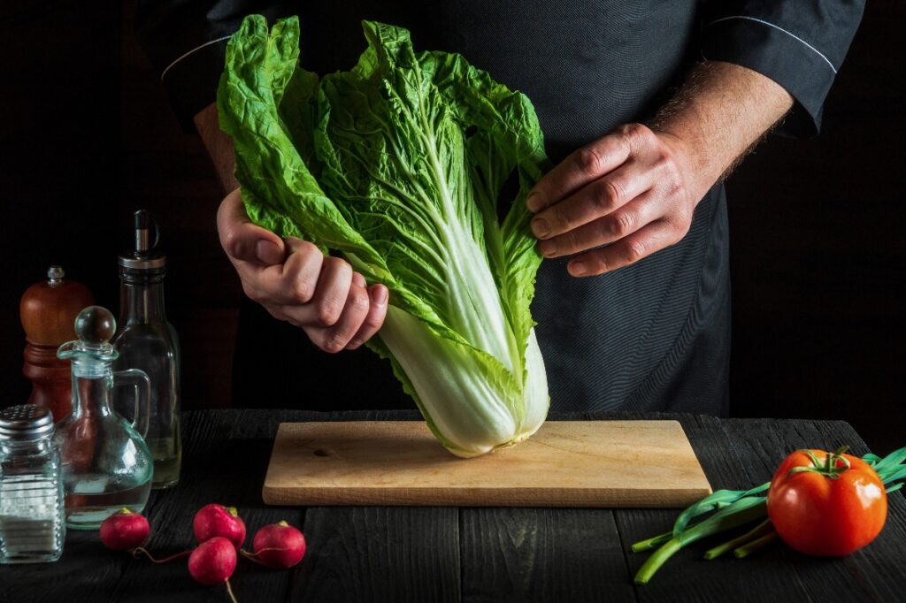 Man preparing napa cabbage